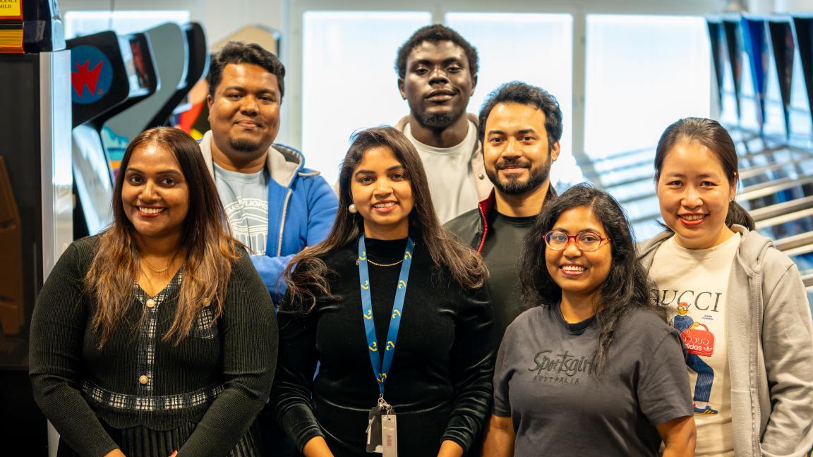 Group of students at the University of Vaasa game hall during the Flipped Mentorship programme with AVEO AI.